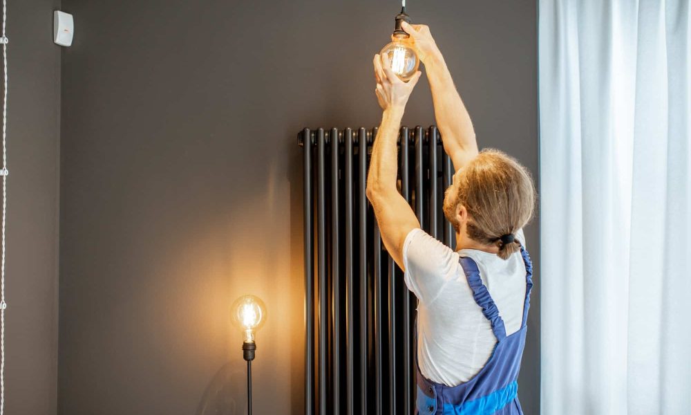 handyman-replacing-lightbulb-at-home-1.jpg